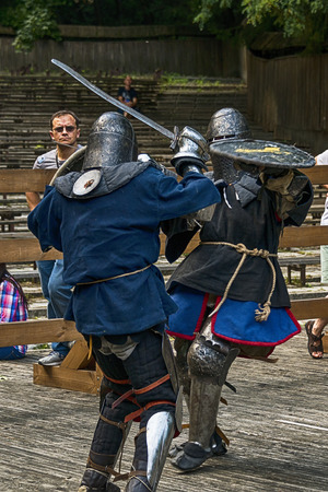 Lviv , Ukraine â august , 04, 2018:  Festival of medieval history and knight duels in the city park in Lviv.Knights fight in group battlesのeditorial素材