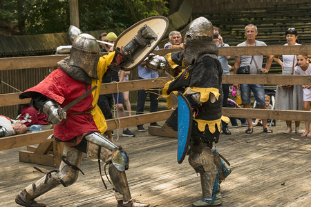 Lviv , Ukraine â august , 04, 2018:  Festival of medieval history and knight duels in the city park in Lviv.Knights fight in group battlesのeditorial素材