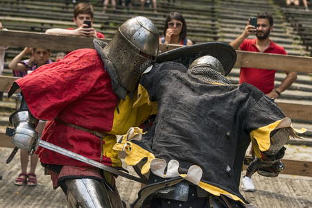 Lviv , Ukraine â august , 04, 2018:  Festival of medieval history and knight duels in the city park in Lviv.Knights fight in group battlesのeditorial素材