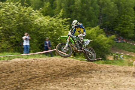 Lviv , Ukraine - May 12 2019:  Open Cup of Lviv on the motocross track Mayorovka.  Motorcycle racer Roman Kruk overcome the track in the fight for the championship.のeditorial素材