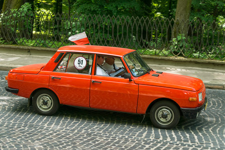 Lviv, Ukraine - June 2, 2019: Old retro car WARTBURG with its owner and  unknown passenger taking...