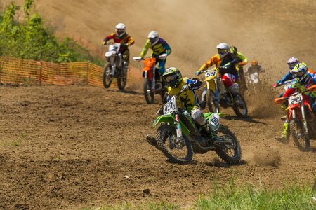 Lviv , Ukraine - May 12 2019:  Open Cup of Lviv on the motocross track Mayorovka.  Unknown  motorcycle racers overcome the track in the fight for the championship.のeditorial素材