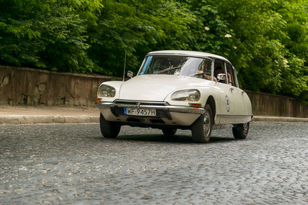 Lviv, Ukraine - June 2, 2019: Old retro car Citroen DS (1970) with its owner and  unknown passenger...