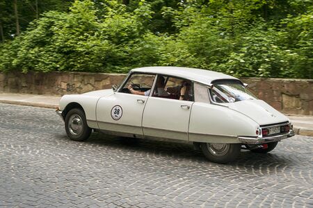 Lviv, Ukraine - June 2, 2019: Old retro car Citroen DS (1970) with its owner and  unknown passenger taking participation in race Leopolis grand prix 2019, Ukraine.のeditorial素材