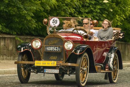 Lviv, Ukraine - June 2, 2019: Old retro car Willys Knight (1920)  with its owner and  unknown passenger taking participation in race Leopolis grand prix 2019, Ukraine.のeditorial素材