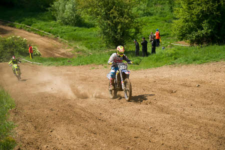 Lviv, Ukraine - May 20 2018: Open Cup of Lviv on the motocross track Mayorovka. Unknown motorcycle racer overcomes motocross track in the fight for the championship.のeditorial素材