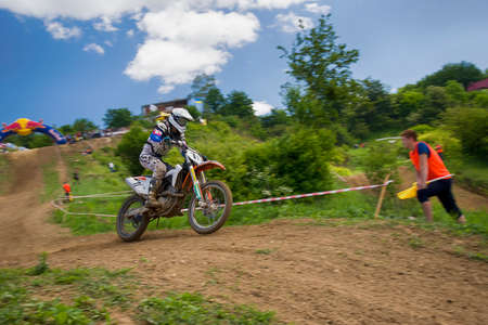 Lviv, Ukraine - May 20 2018: Open Cup of Lviv on the motocross track Mayorovka. Unknown motorcycle racer overcomes motocross track in the fight for the championship.のeditorial素材