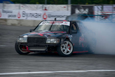 Lviv, Ukraine - June 4, 2016: Unknown rider on the car brand Mercedes-Benz overcomes the track in the championship of Ukraine drifting in Lviv, Ukraine.のeditorial素材