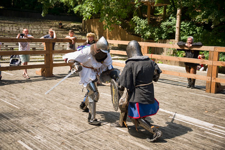 Lviv, Ukraine august, 04,2018: Festival of medieval history and knight duels in the city park in Lviv. Knights fight in group battles.のeditorial素材