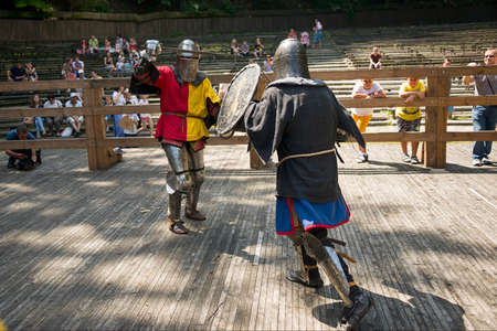 Lviv, Ukraine august, 04,2018: Festival of medieval history and knight duels in the city park in Lviv. Knights fight in group battles.のeditorial素材