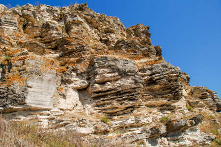 layered rock face seen on a quarryの写真素材
