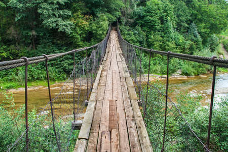 Suspension bridge, Crossing the river, ferriage in the woodsの写真素材