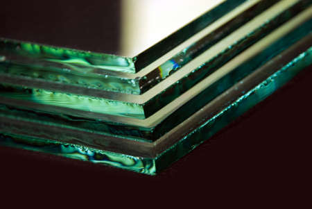 Sheets of Factory manufacturing tempered clear float glass panels cut to size.の写真素材