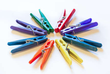 Color clothes-peg isolated on white backgroundの写真素材