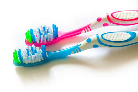 Two toothbrushes isolated on white background closeupの写真素材