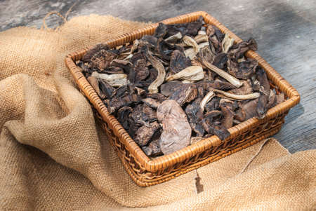 dried mushrooms, on a wooden tableの写真素材