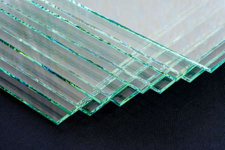 Sheets of Factory manufacturing tempered clear float glass panels cut to size.の写真素材
