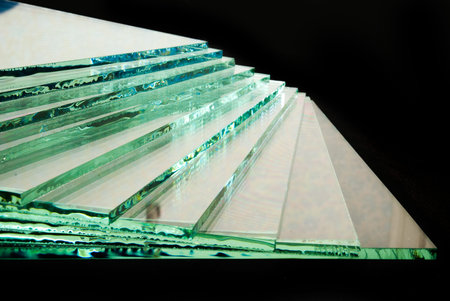 Sheets of Factory manufacturing tempered clear float glass panels cut to size.の写真素材