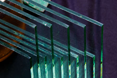 Sheets of Factory manufacturing tempered clear float glass panels cut to size.の写真素材