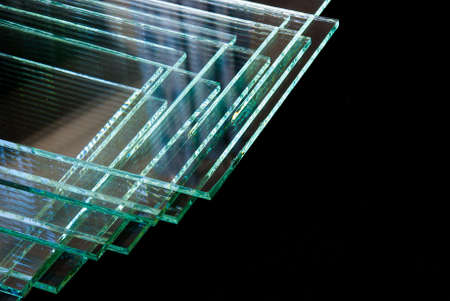 Sheets of Factory manufacturing tempered clear float glass panels cut to size.の写真素材