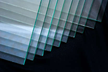 Sheets of Factory manufacturing tempered clear float glass panels cut to size.の写真素材