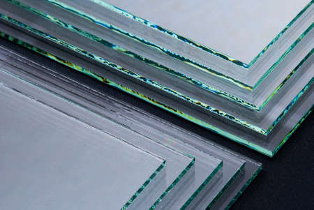 Sheets of Factory manufacturing tempered clear float glass panels cut to size.の写真素材