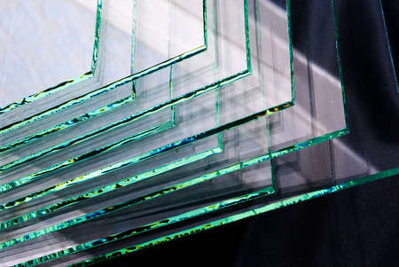 Sheets of Factory manufacturing tempered clear float glass panels cut to size.の写真素材