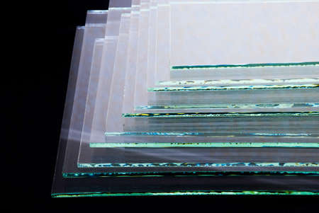 Sheets of Factory manufacturing tempered clear float glass panels cut to size.の写真素材