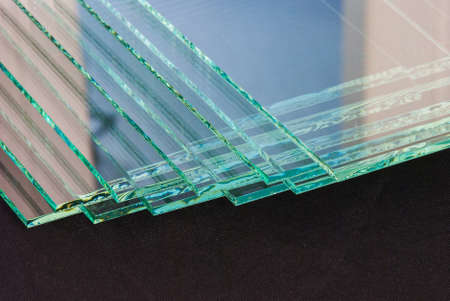 Sheets of Factory manufacturing tempered clear float glass panels cut to size.の写真素材