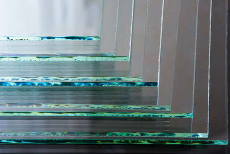 Sheets of Factory manufacturing tempered clear float glass panels cut to size.の写真素材