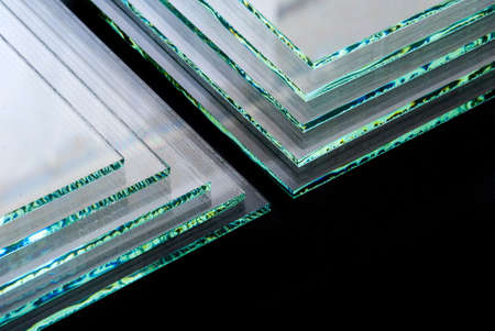 Sheets of Factory manufacturing tempered clear float glass panels cut to size.の写真素材