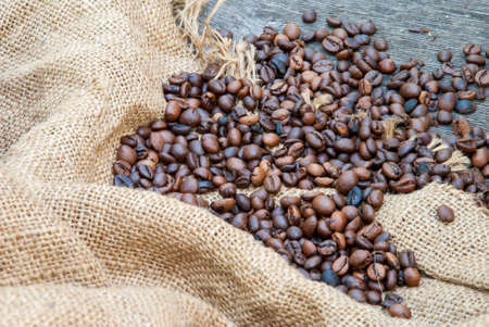 coffee beans on a rough sacking.の写真素材
