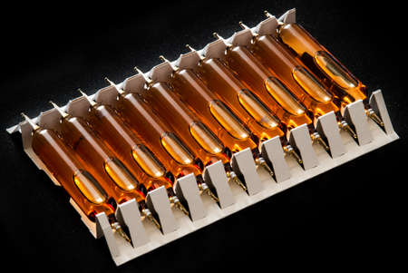 Ampoules isolated on black background.の写真素材