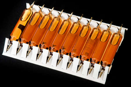 Ampoules isolated on black background.の写真素材