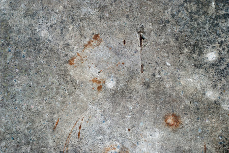 Rough stone wall with cracks of gray.の写真素材