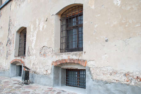 ancient windows in a stone wall.の写真素材