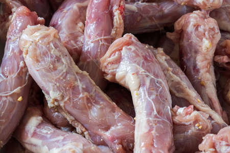 Raw fresh chicken neck in the white plate. Isolated on whiteの写真素材