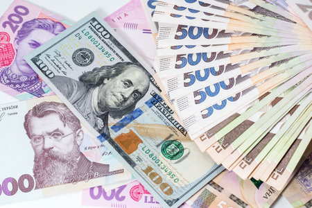 Ukrainian money - hryvnia banknotes USA dollars bills. Finance in Ukraine, of the hryvnia to the...