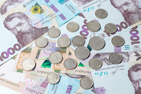 New banknotes and coins Ukrainian Hryvnia.