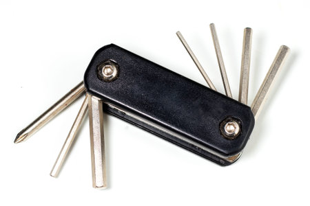 Bicycle multi-function tool with keys and screwdrivers.