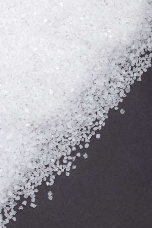 white crystals sea salt on darck background.の写真素材