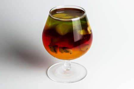 Jelly with kiwi and fruits in a cupの写真素材