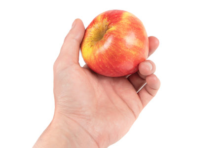 Hand hold red apple. isolated on white background.