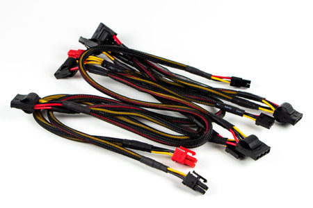 Computer power supply cables isolated on a white background.