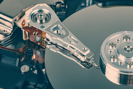 Disassembled hard drive from the computer, hdd with mirror effect. Opened hard drive from the...