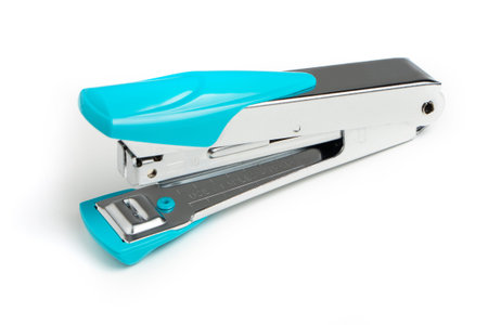 Stapler and metal staple concept over white background.