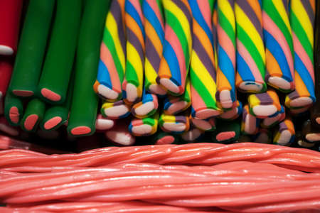 Sweet candies rope string shaped sweets dessert food generate a beautiful colorful and interesting pattern.の写真素材
