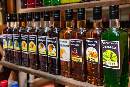 Yaremche Ukraine. 25 june 2021: Bottles with handmade liqueur on the shelves. Alcoholic drinks from...