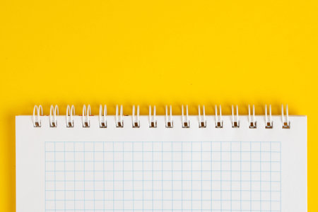Notebook on a yellow background.