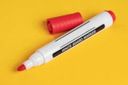 Color markers on yellow background. close up.